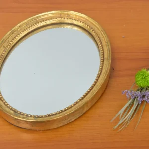 Miroir doré ovale